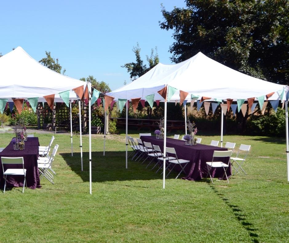 outdoor party dining tables under canopy tents